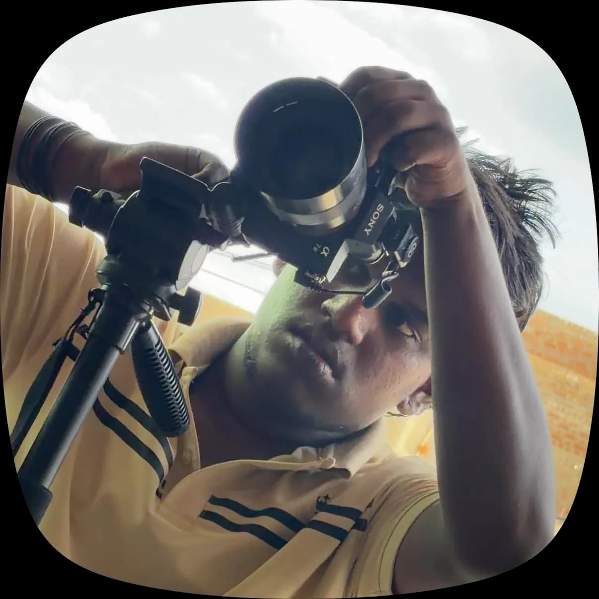 A Vellappaniyaram Studio photographer shooting on a tripod-mounted camera
