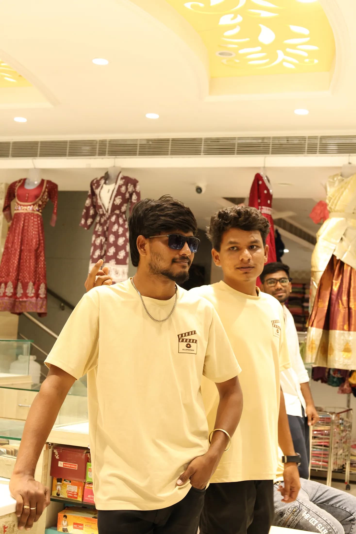Inside a clothing showroom with garments on display